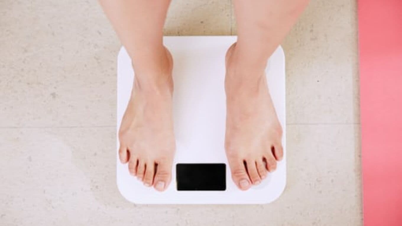A picture of someone's feet stood on body weight scales
