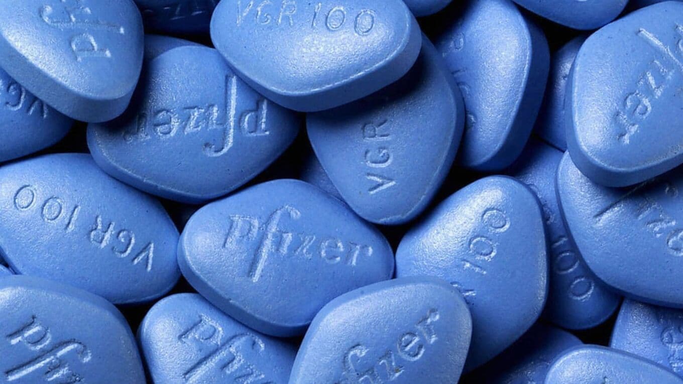 A closeup of multiple blue Viagra pills